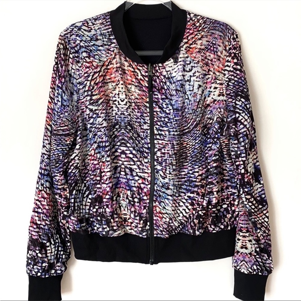 Zella Black Reversible Bomber Jacket. One side is multicolored. 2 front pockets